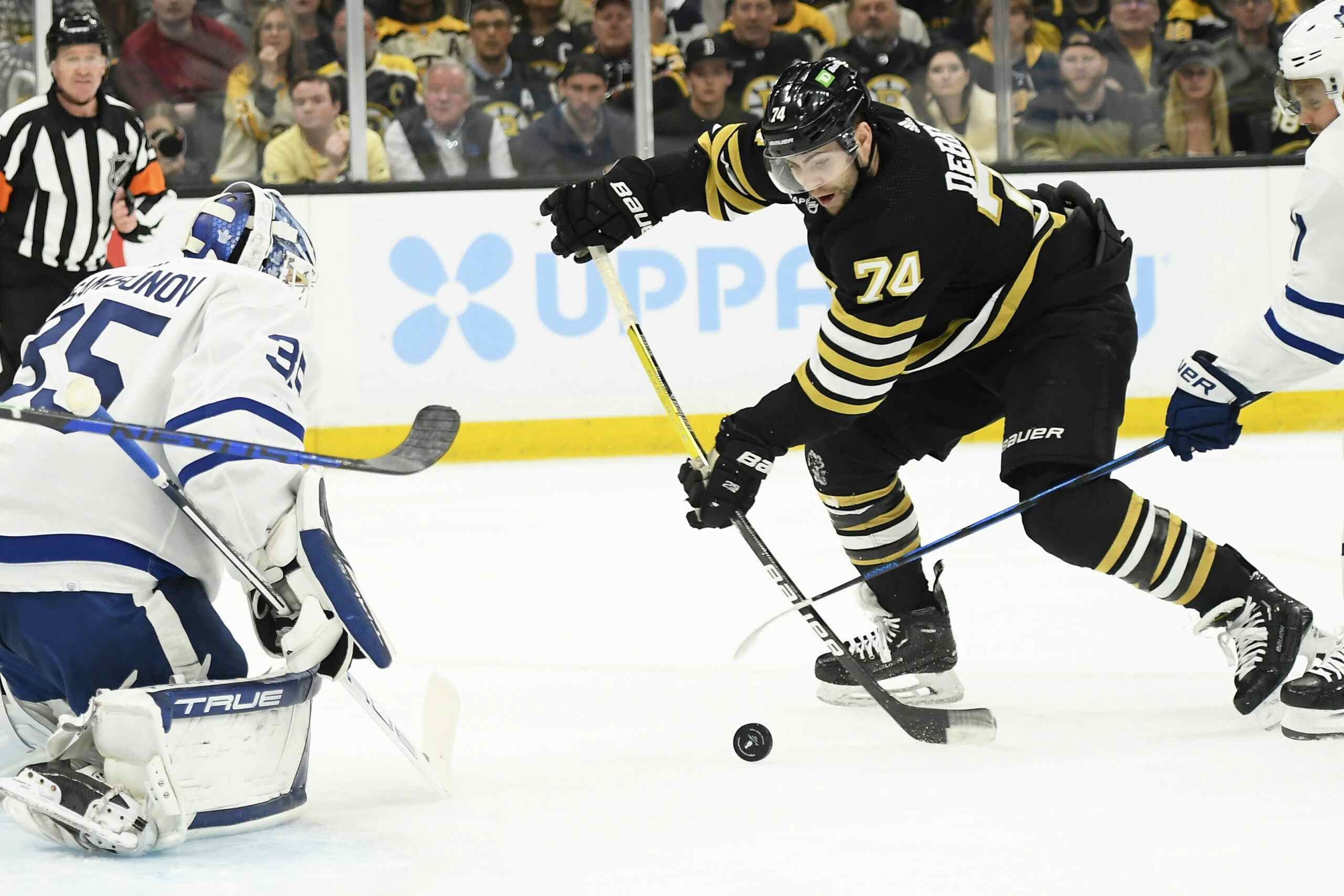 Boston Bruins winger Jake DeBrusk shoots on Ilya Samsonov of the Toronto Maple Leafs.