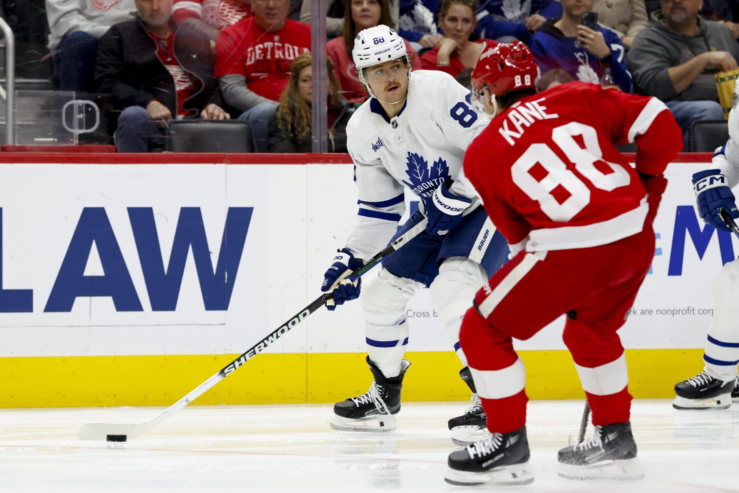 Toronto Maple Leafs right wing William Nylander (88) skates with the puck defended by Detroit Red Wings right wing Patrick Kane (88) in the third period at Little Caesars Arena.